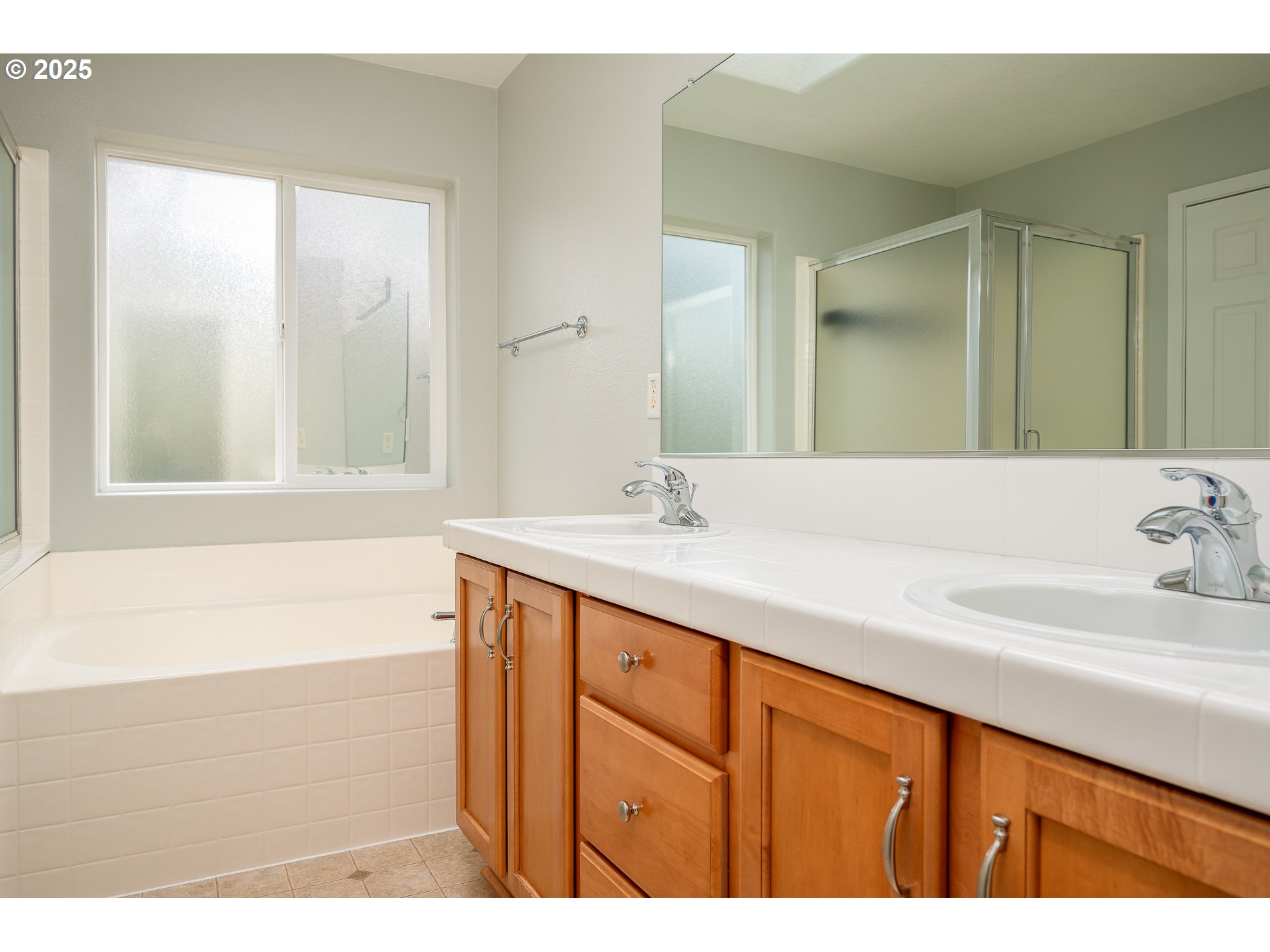 10636 Southwest 43rd Avenue Portland, OR 97219 - Photo 27 of 48 a bathroom with a sink and a bathtub