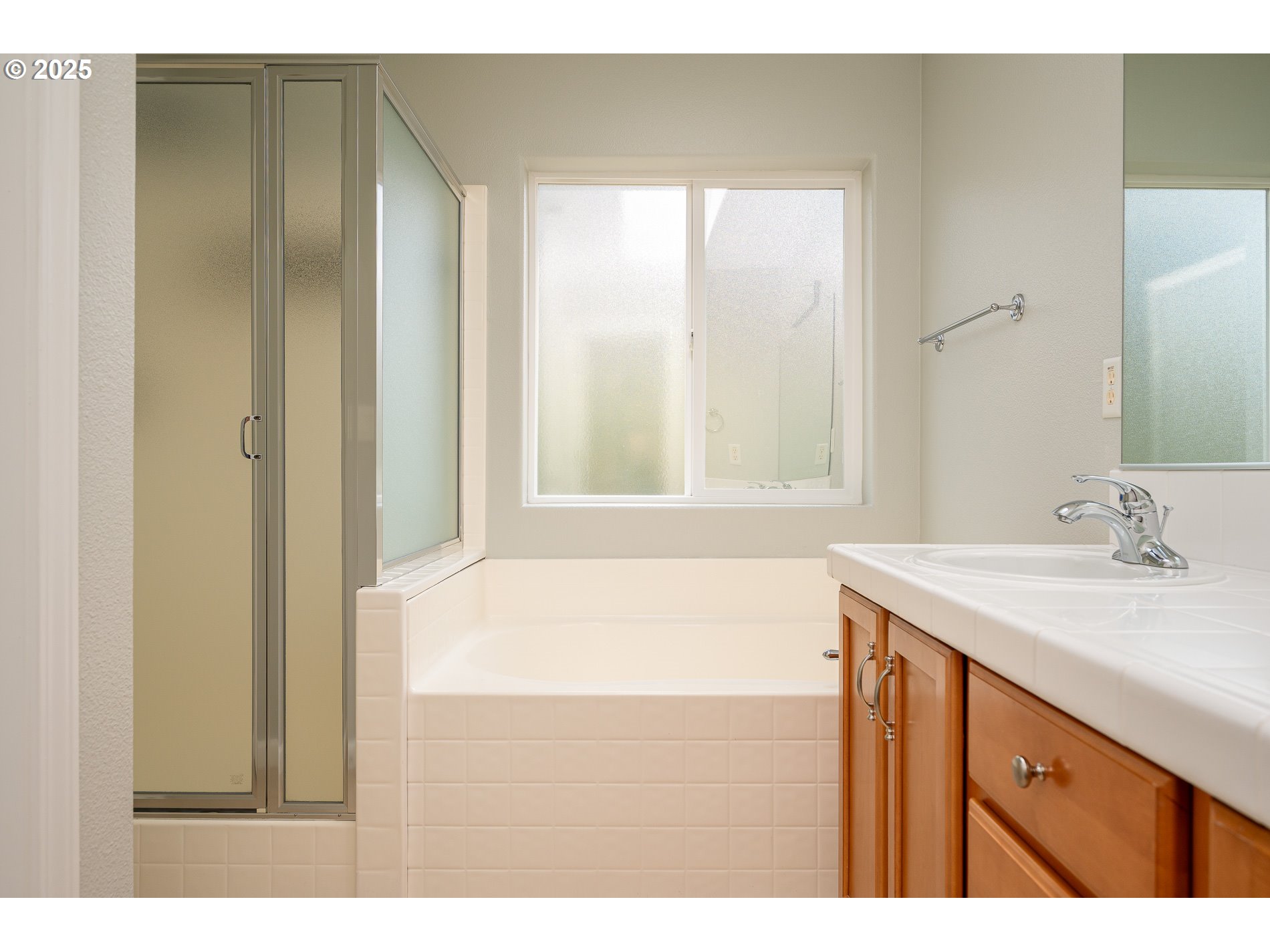 10636 Southwest 43rd Avenue Portland, OR 97219 - Photo 28 of 48 a bathroom with a sink and a bathtub
