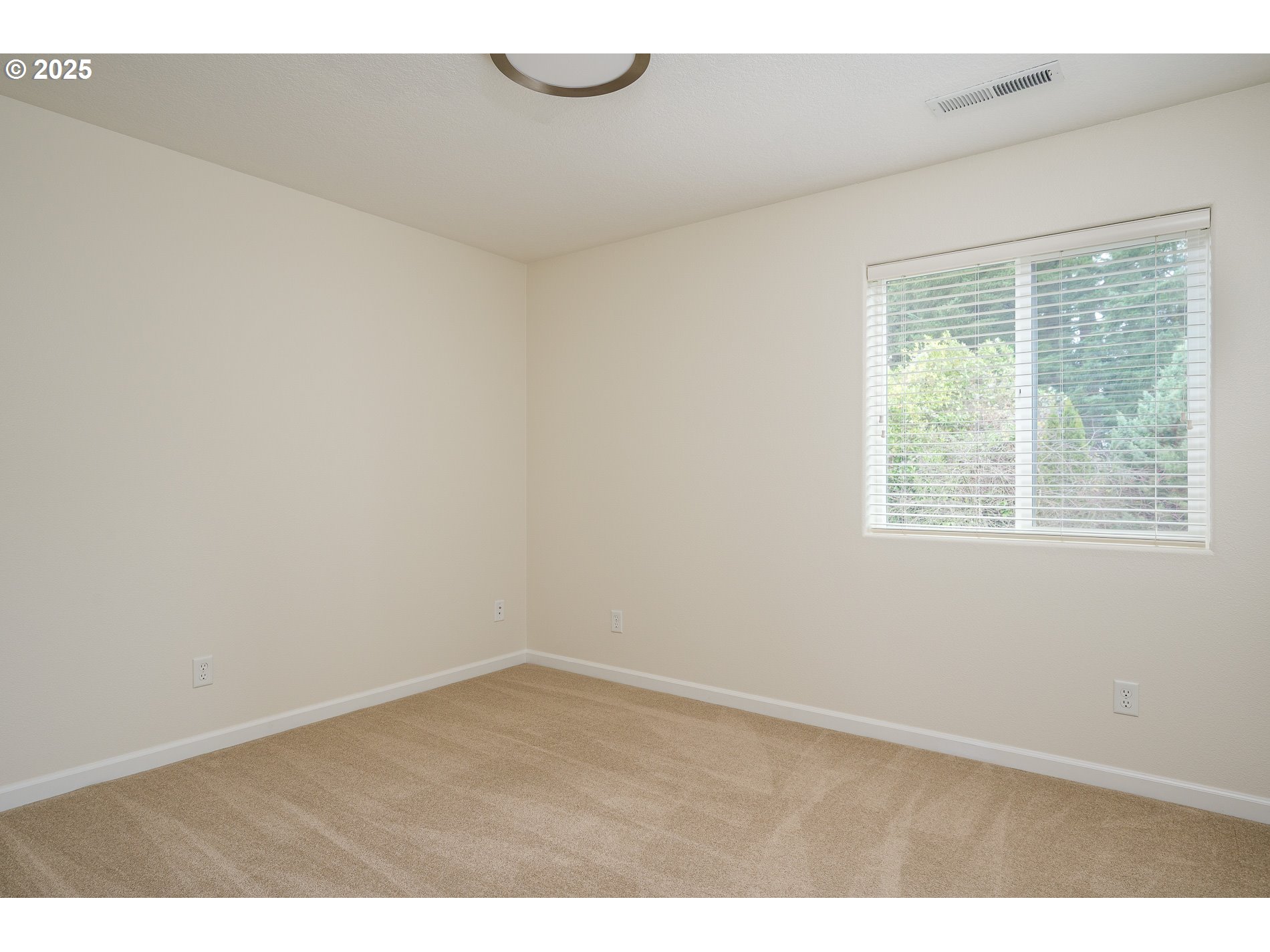 10636 Southwest 43rd Avenue Portland, OR 97219 - Photo 30 of 48 a view of an empty room with a window