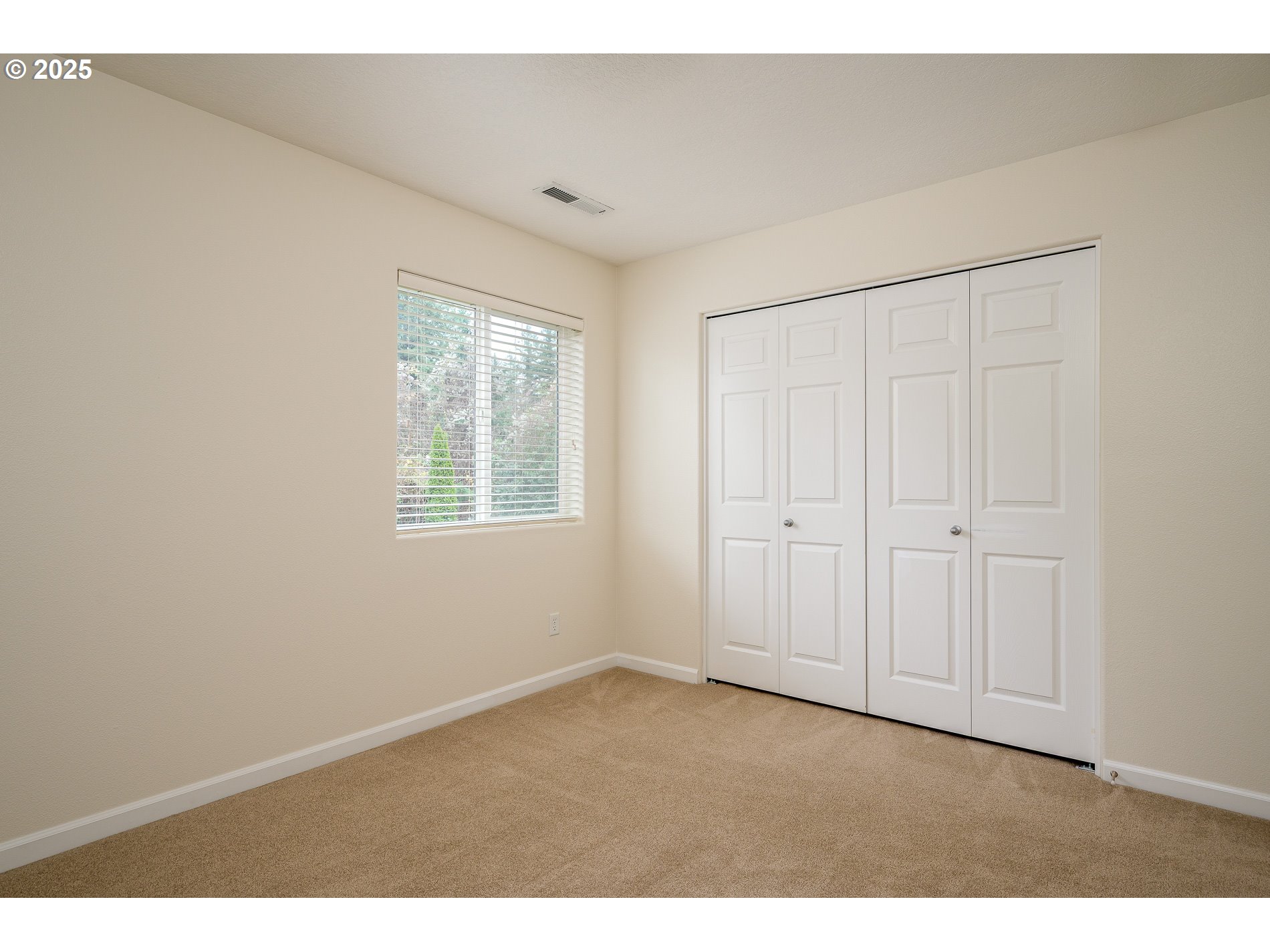 10636 Southwest 43rd Avenue Portland, OR 97219 - Photo 31 of 48 a view of an empty room with a window