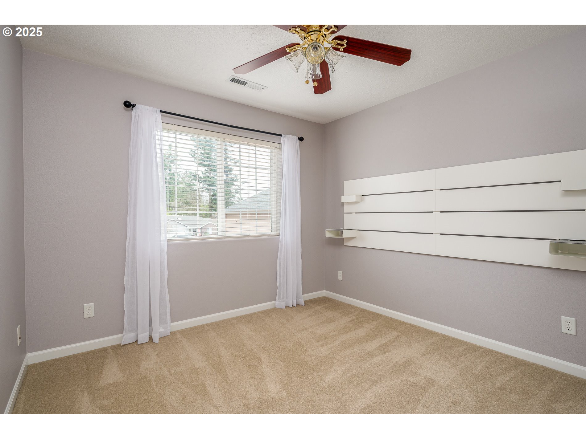 10636 Southwest 43rd Avenue Portland, OR 97219 - Photo 33 of 48 a view of an empty room with a window