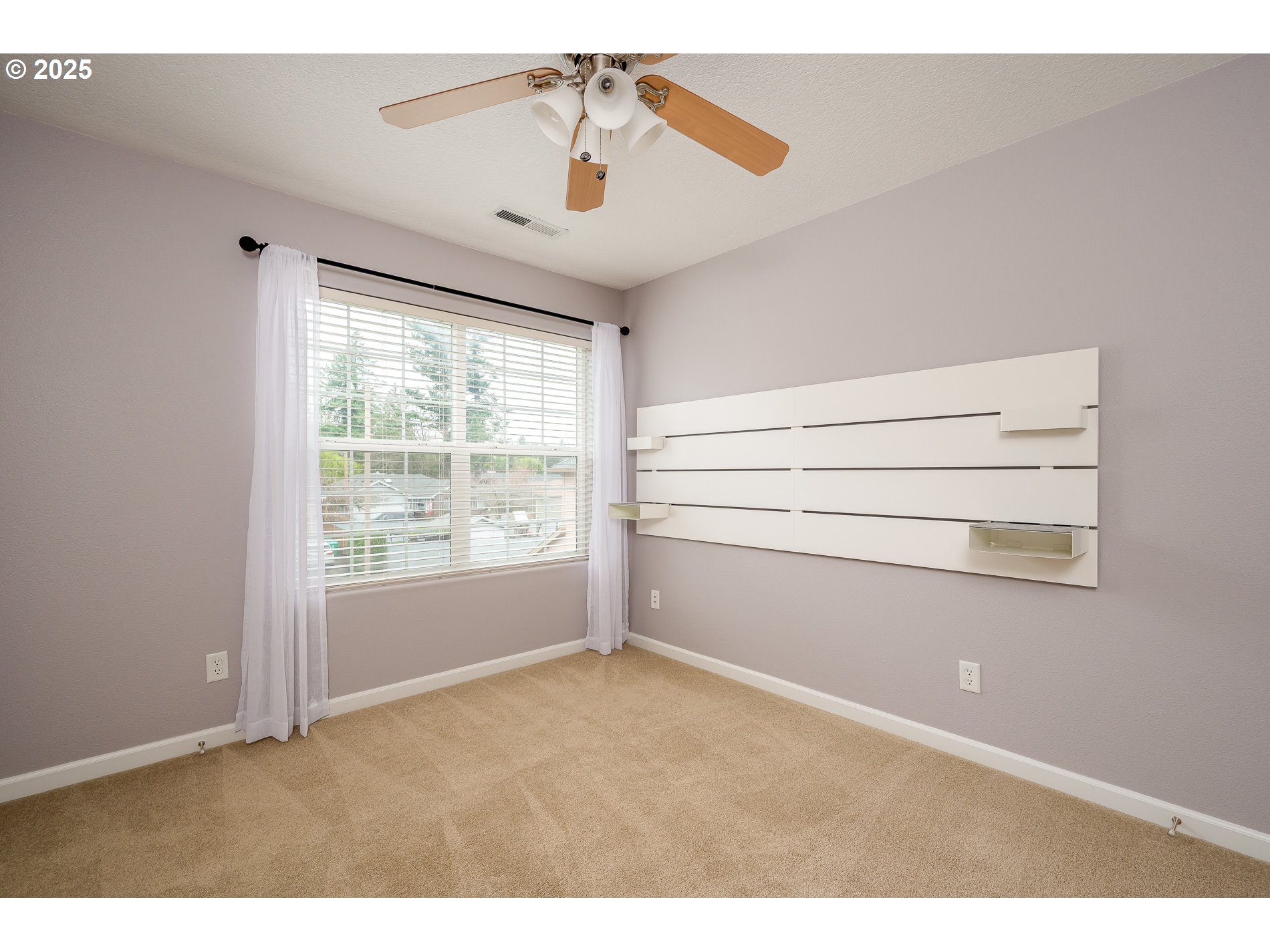 10636 Southwest 43rd Avenue Portland, OR 97219 - Photo 36 of 48 a view of an empty room with a window