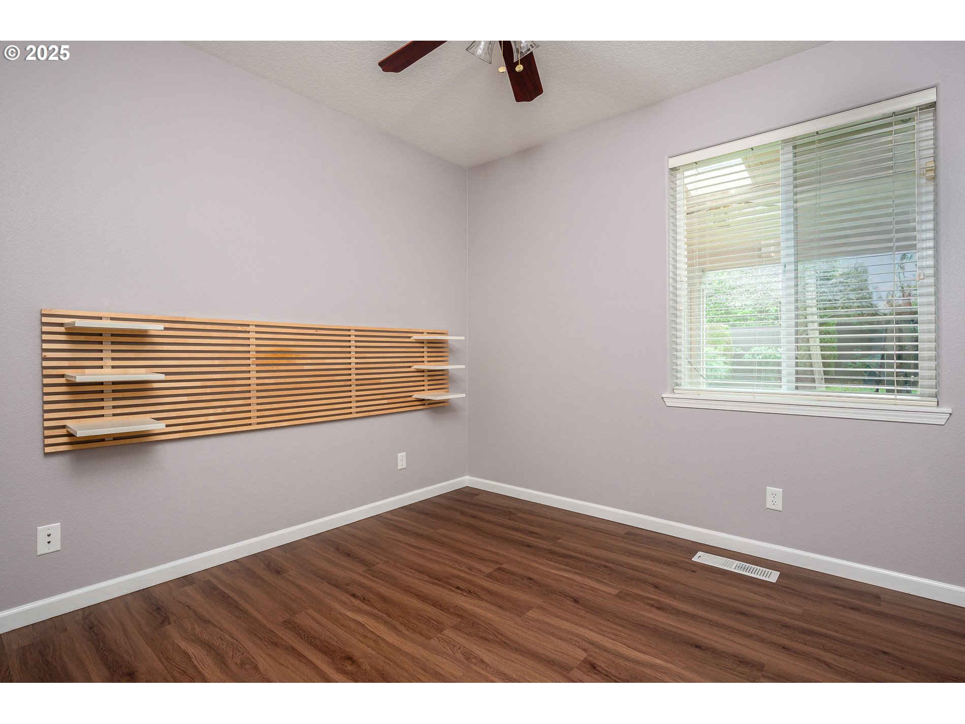 10636 Southwest 43rd Avenue Portland, OR 97219 - Photo 40 of 48 a view of an empty room with wooden floor and a window