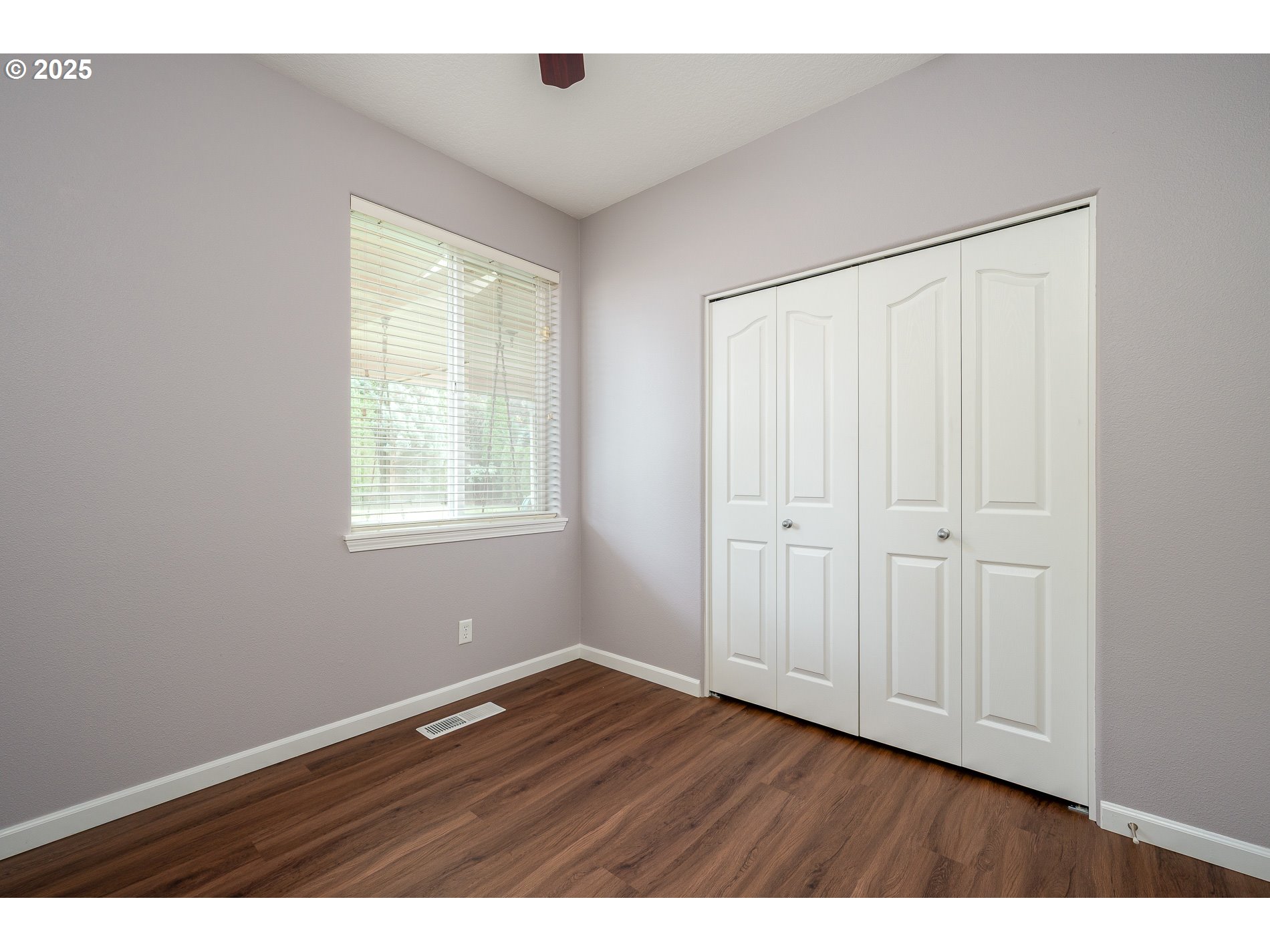 10636 Southwest 43rd Avenue Portland, OR 97219 - Photo 41 of 48 a view of an empty room with wooden floor and a window