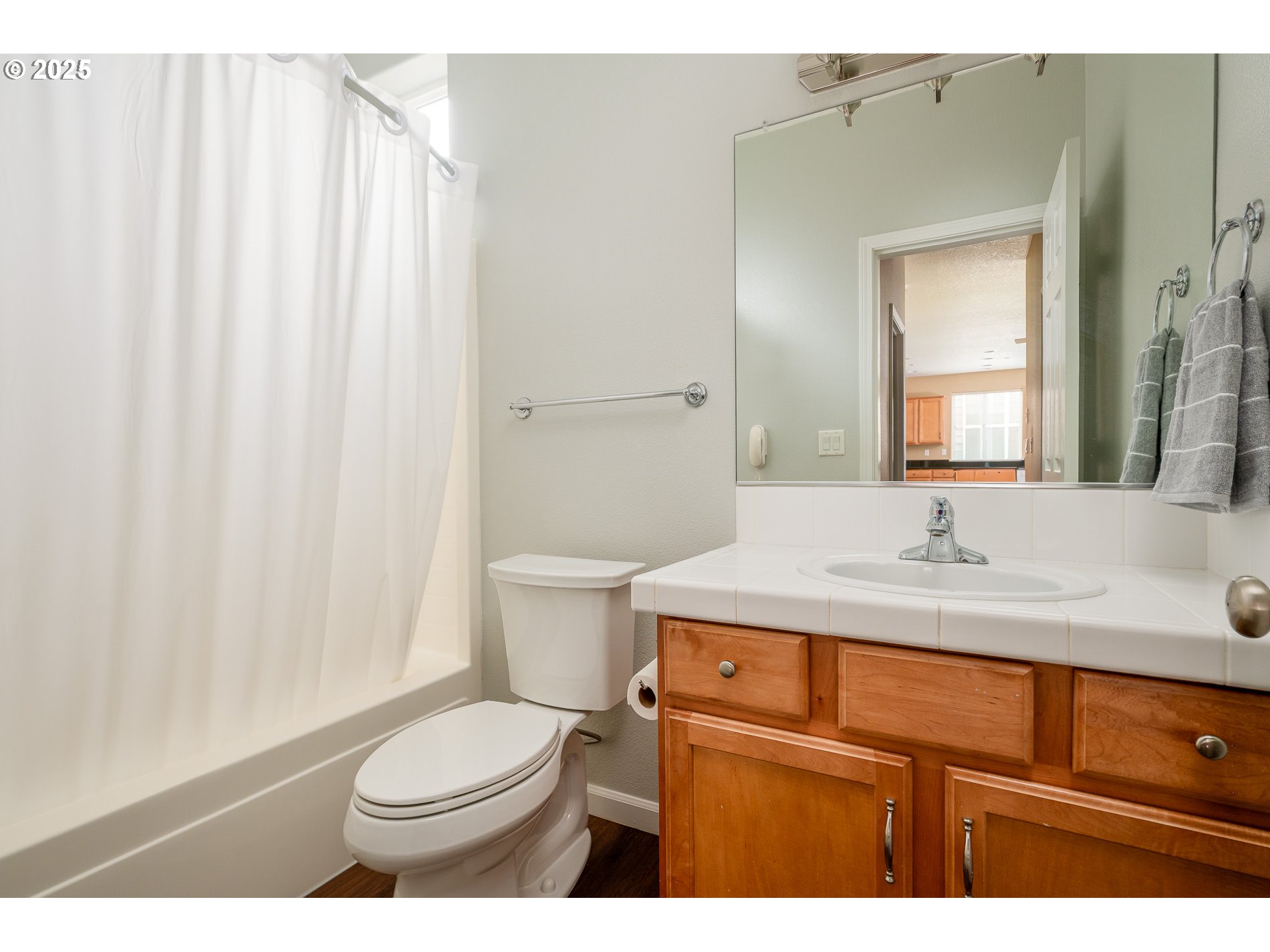 10636 Southwest 43rd Avenue Portland, OR 97219 - Photo 42 of 48 a bathroom with a toilet a sink and a mirror