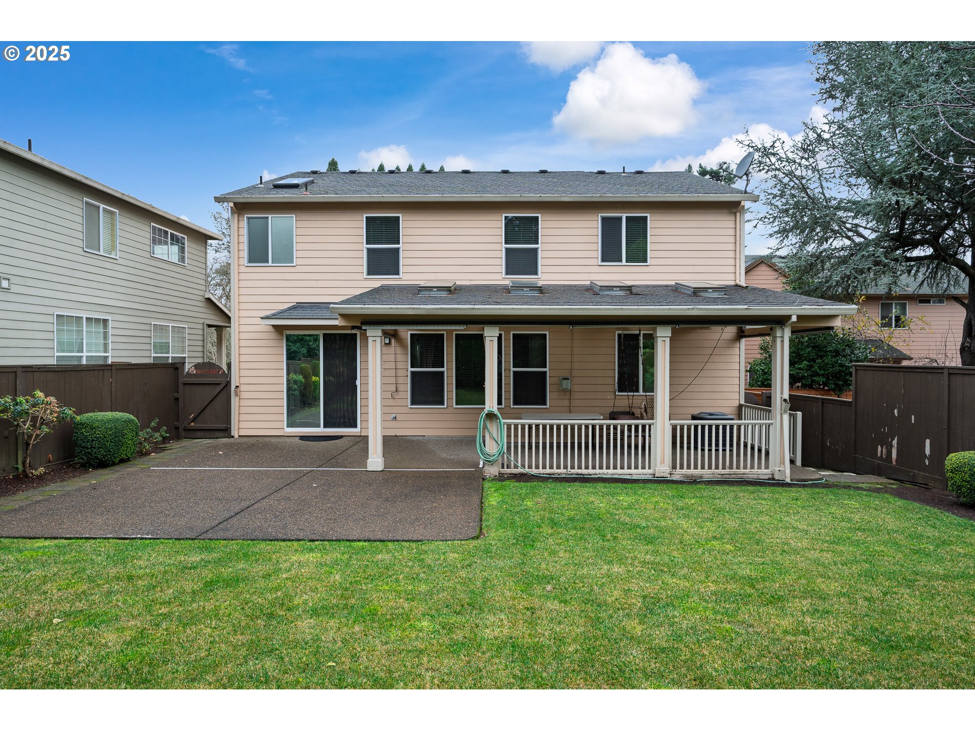 10636 Southwest 43rd Avenue Portland, OR 97219 - Photo 47 of 48 a view of a house with a yard and sitting area