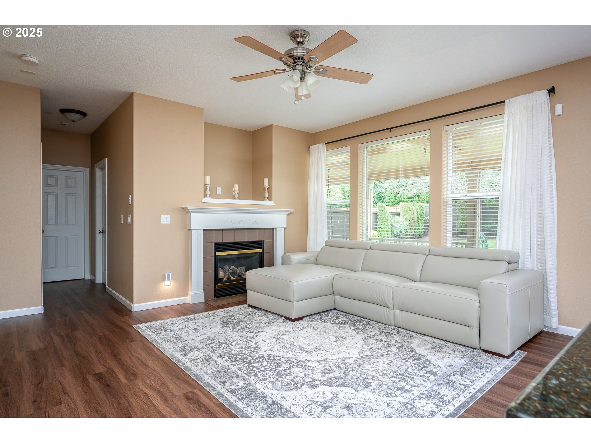 10636 Southwest 43rd Avenue Portland, OR 97219 - Photo 8 of 48 a living room with furniture and a fireplace