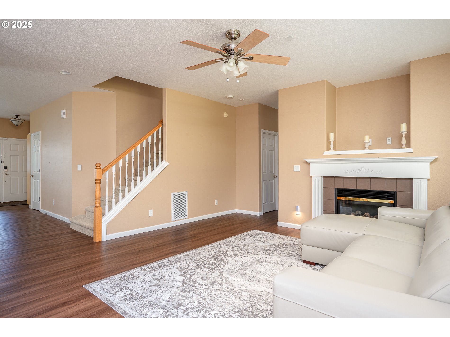 10636 Southwest 43rd Avenue Portland, OR 97219 - Photo 10 of 48 a living room with furniture and a fireplace