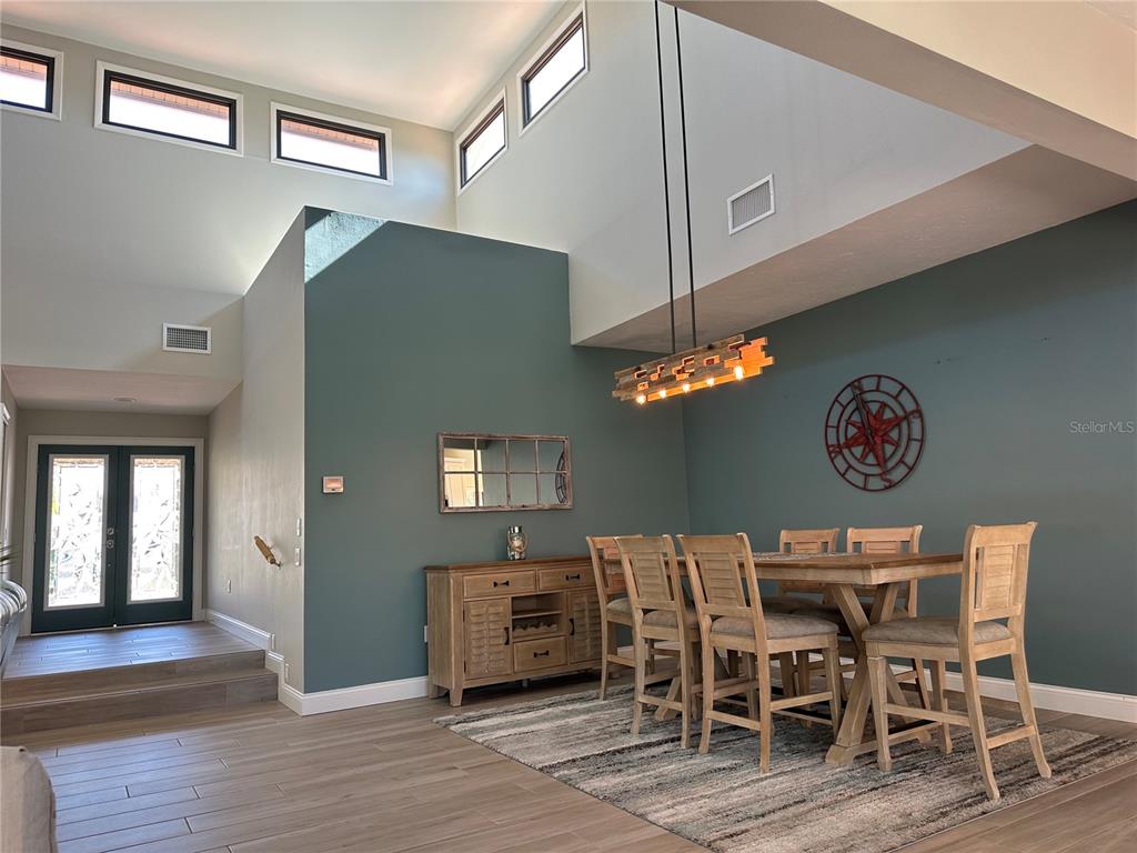 195 Inlets Boulevard, Unit 195 Nokomis, FL 34275 - Photo 25 of 48 a view of a dining room with furniture