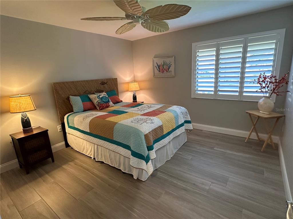 195 Inlets Boulevard, Unit 195 Nokomis, FL 34275 - Photo 33 of 48 a bedroom with a bed and window