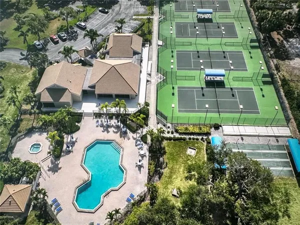 a view of outdoor space with swimming pool and lounge chair