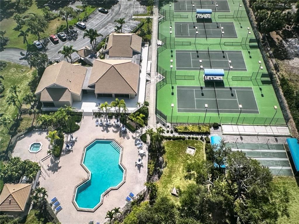 195 Inlets Boulevard, Unit 195 Nokomis, FL 34275 - Photo 37 of 48 an aerial view of a house with a swimming pool outdoor seating and yard