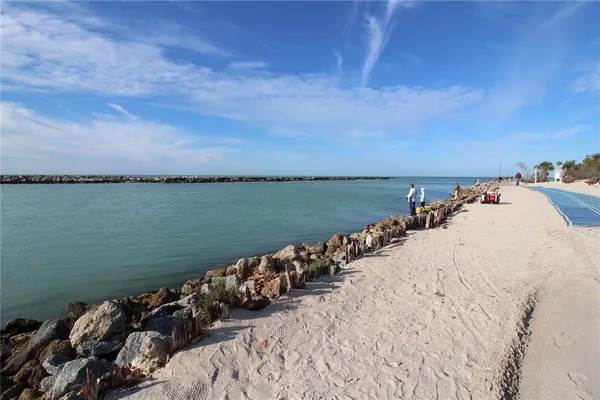 a view of a balcony with wooden floor and outdoor space
