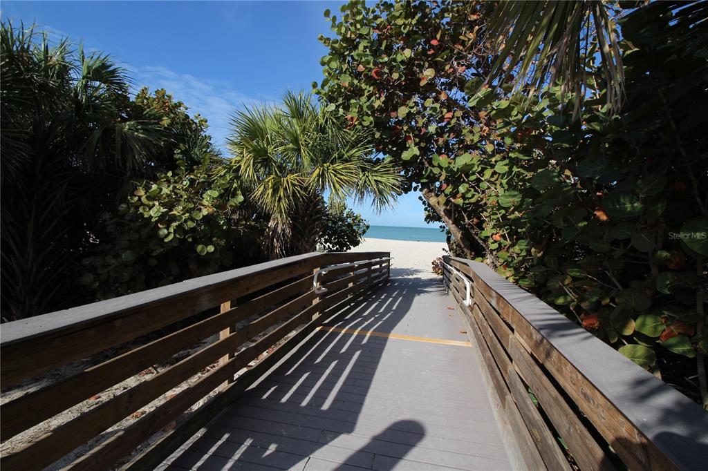 195 Inlets Boulevard, Unit 195 Nokomis, FL 34275 - Photo 47 of 48 a view of a balcony with wooden floor and outdoor space