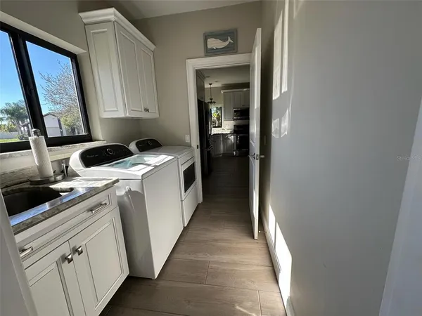 a kitchen with stainless steel appliances a refrigerator and a stove top oven