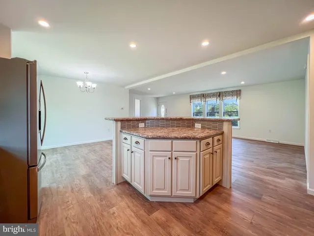a kitchen with a sink and a refrigerator