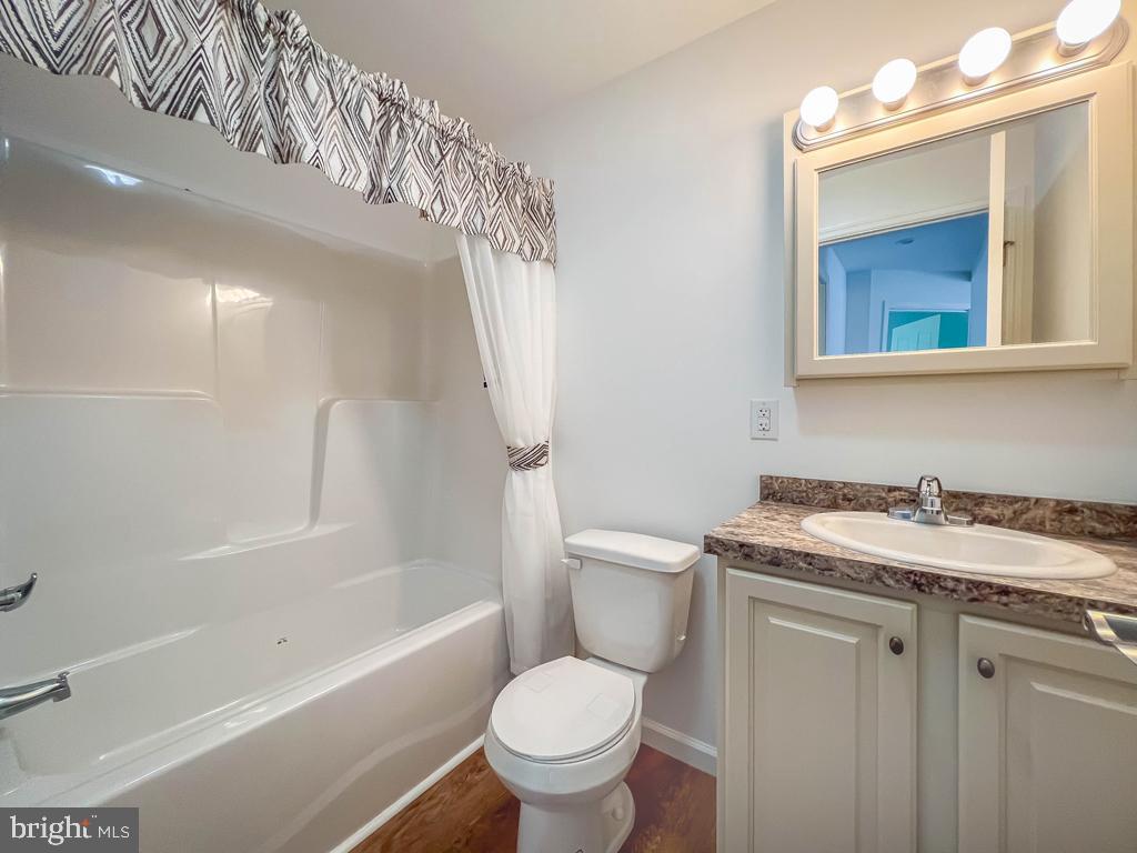 146 Minch Road Parkesburg, PA 19365 - Photo 26 of 44 a white toilet sitting next to a bath tub