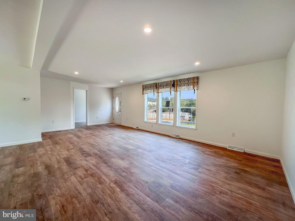 146 Minch Road Parkesburg, PA 19365 - Photo 31 of 44 a view of an empty room with wooden floor and a window