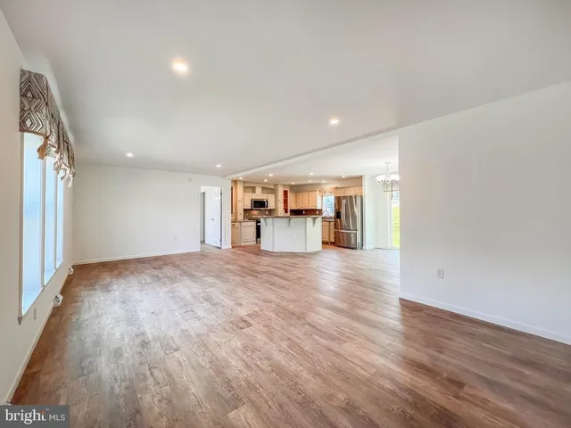 a view of a kitchen with a sink and a window
