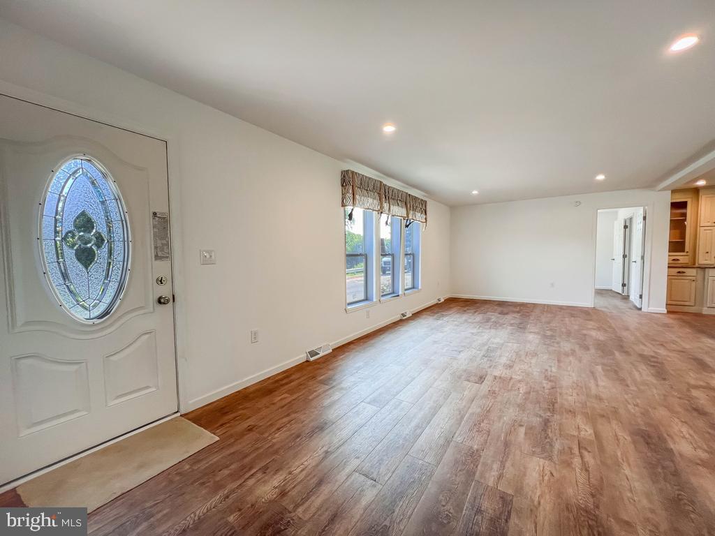 146 Minch Road Parkesburg, PA 19365 - Photo 34 of 44 a view of an empty room with window and wooden floor
