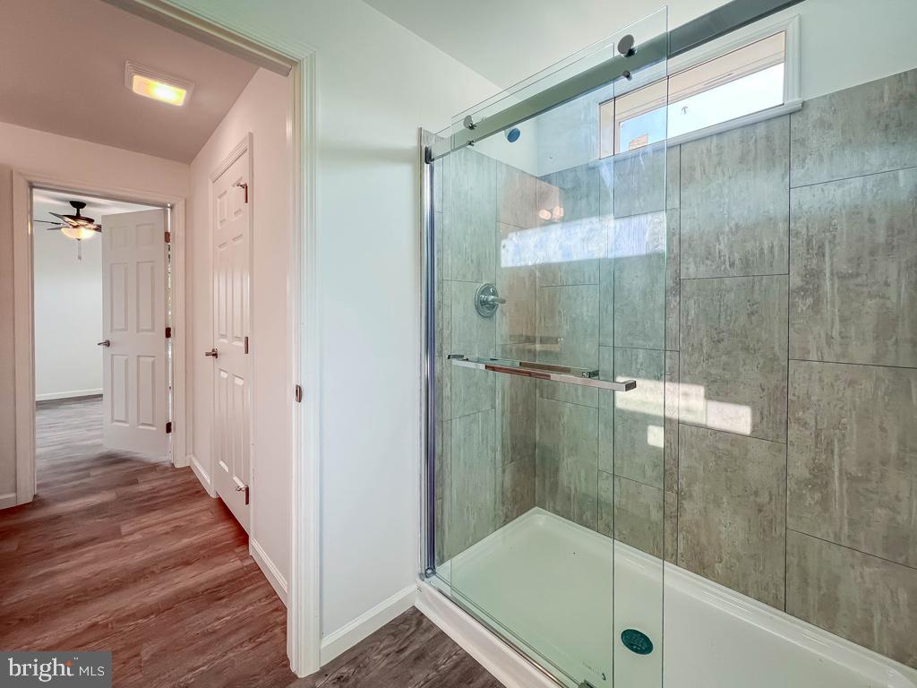 146 Minch Road Parkesburg, PA 19365 - Photo 37 of 44 a bathroom with a glass shower door