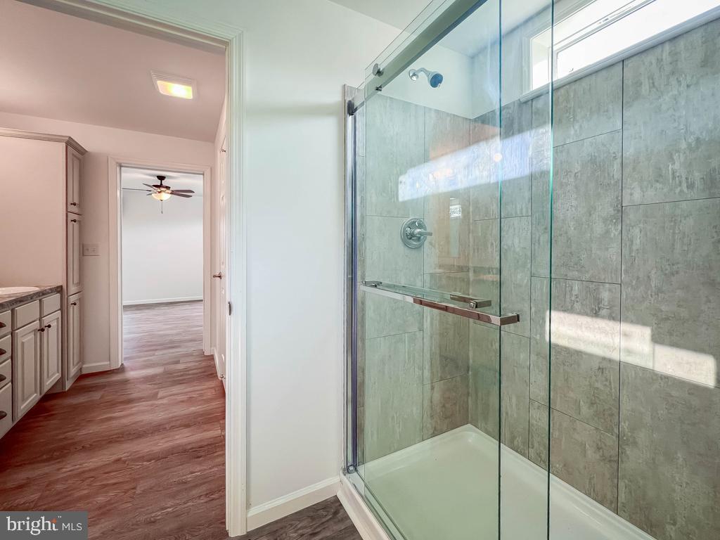 146 Minch Road Parkesburg, PA 19365 - Photo 38 of 44 a bathroom with a glass shower door and a sink