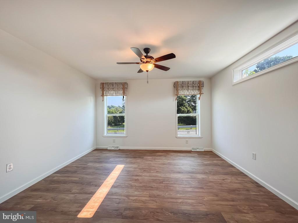 146 Minch Road Parkesburg, PA 19365 - Photo 43 of 44 a view of an room with wooden floor and a ceiling fan