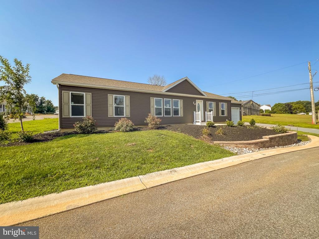 146 Minch Road Parkesburg, PA 19365 - Photo 5 of 44 a front view of a house with a yard and potted plants
