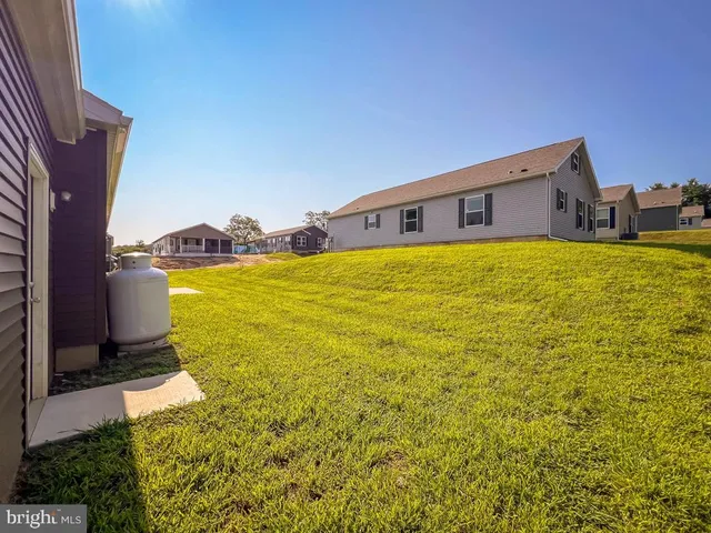 a house view with a big yard