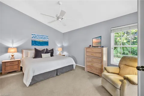 a spacious bedroom with a bed and furniture