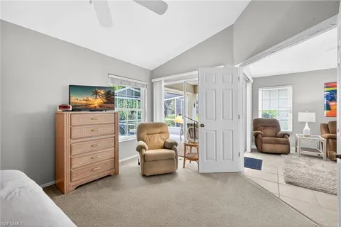 a living room with furniture and a flat tv screen