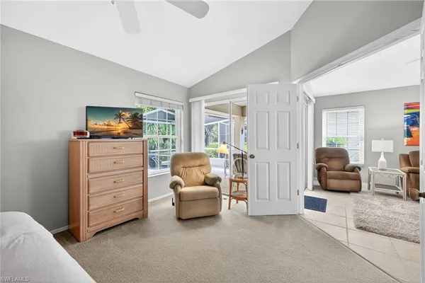 a living room with furniture and a flat tv screen