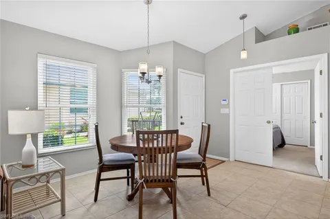 a view of a livingroom with furniture and a window