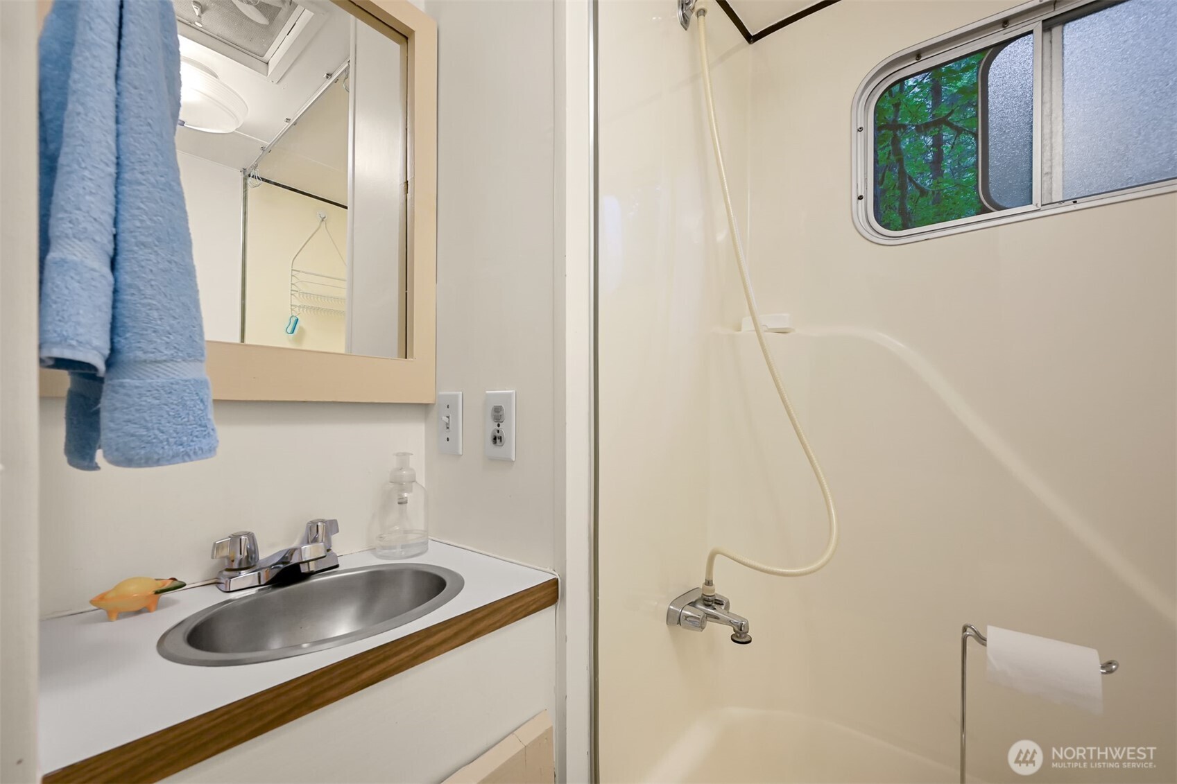 1107 Birch Lane Maple Falls, WA 98266 - Photo 11 of 40 a bathroom with a sink and mirror with window
