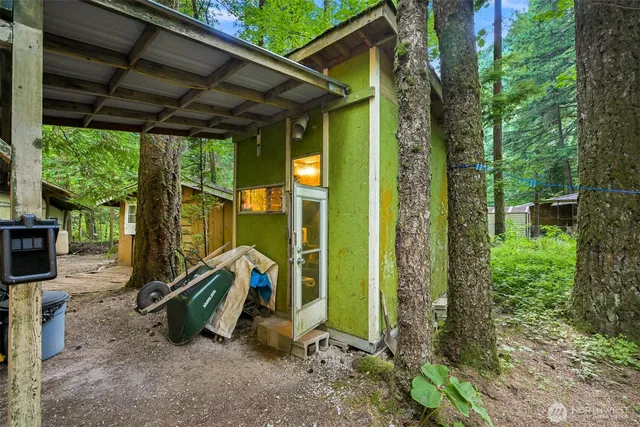 a view of a patio with table and chairs and wooden floor
