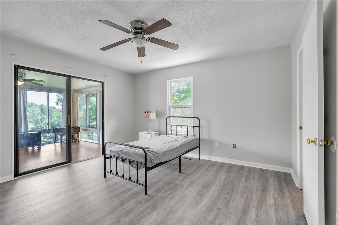 48 Tierra Drive Waterloo, SC 29384 - Photo 39 of 42 Glass sliding doors open from this bedroom onto a spacious enclosed back porch.
