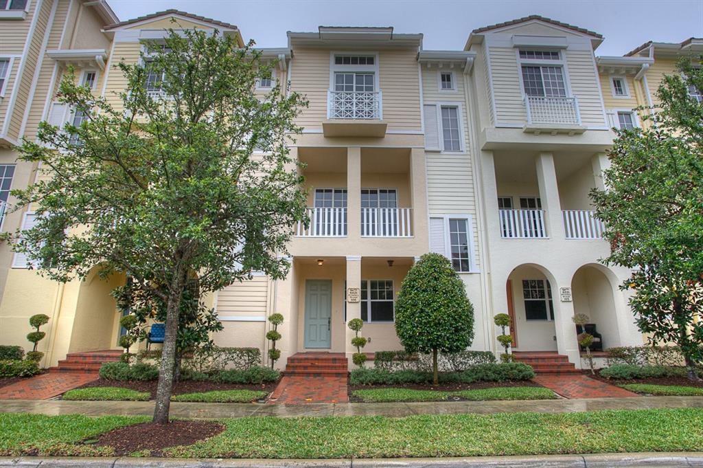 6021 Printery Street, Unit 106 Tampa, FL 33616 - Photo 1 of 23 front view of a house with a yard