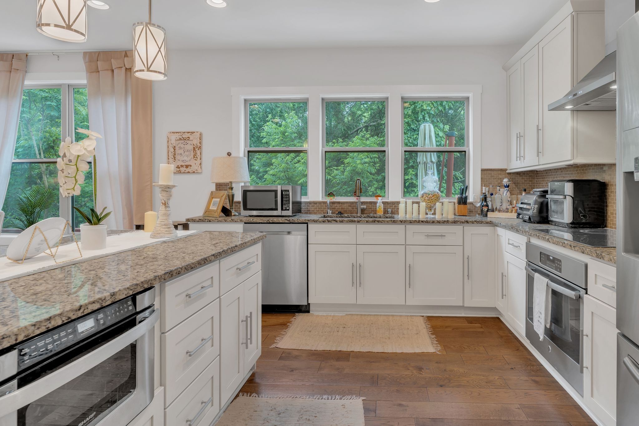 1708 Comanche Run Madison, TN 37115 - Photo 17 of 36 a kitchen with a sink stove and cabinets