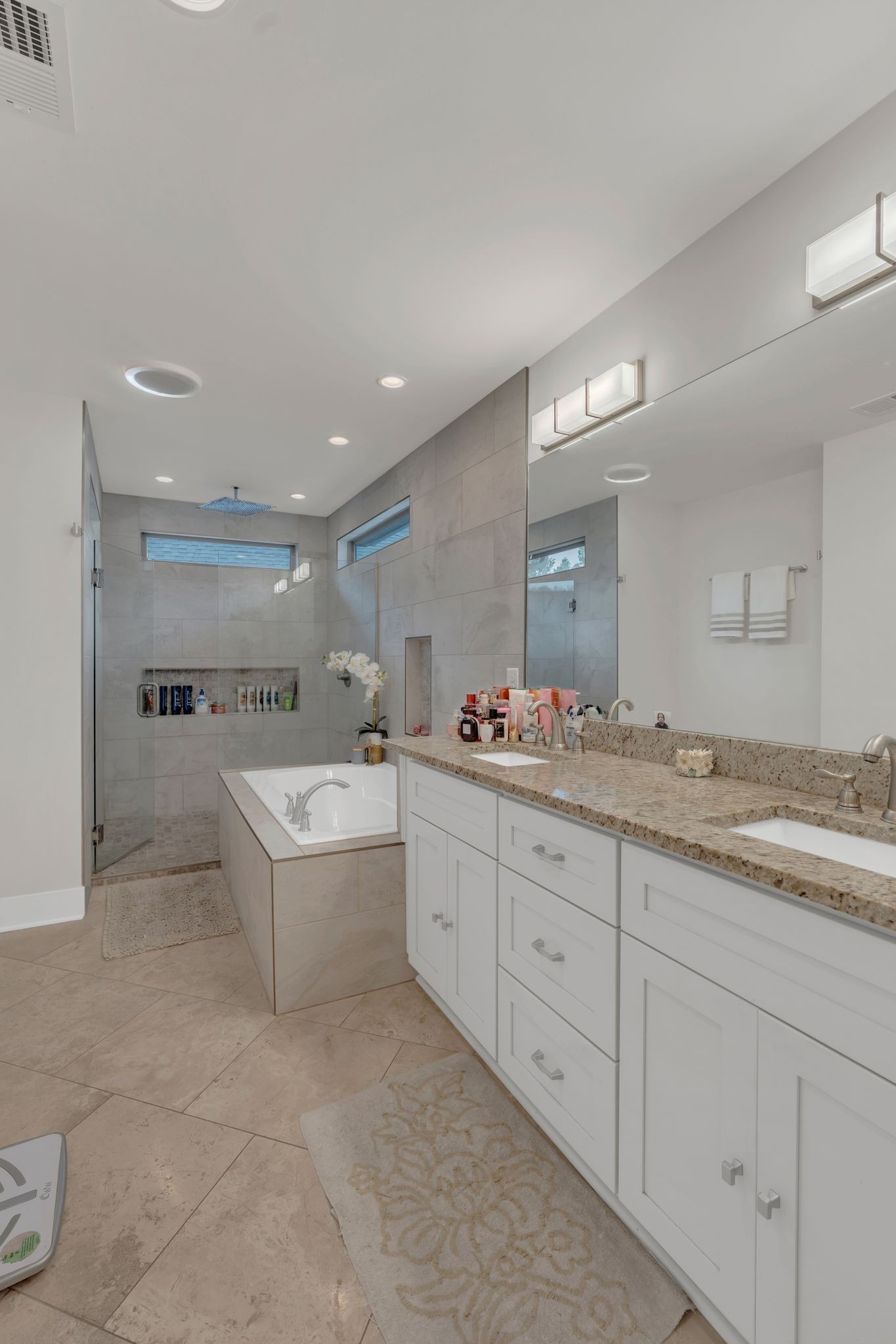 1708 Comanche Run Madison, TN 37115 - Photo 28 of 36 a bathroom with a granite countertop sink mirror and bathtub