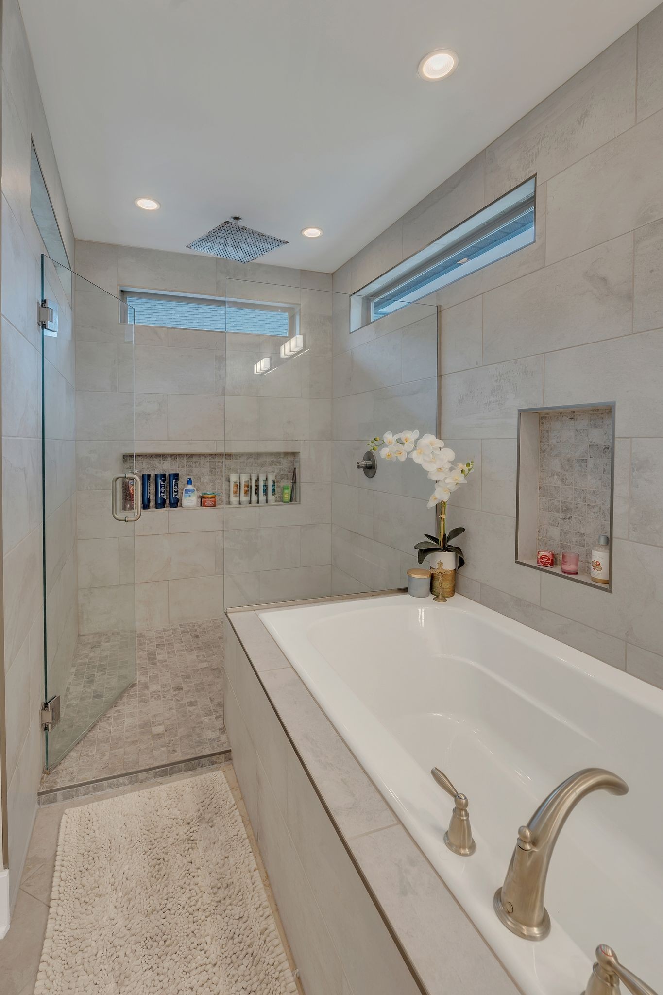 1708 Comanche Run Madison, TN 37115 - Photo 29 of 36 a bathroom with a tub and a shower