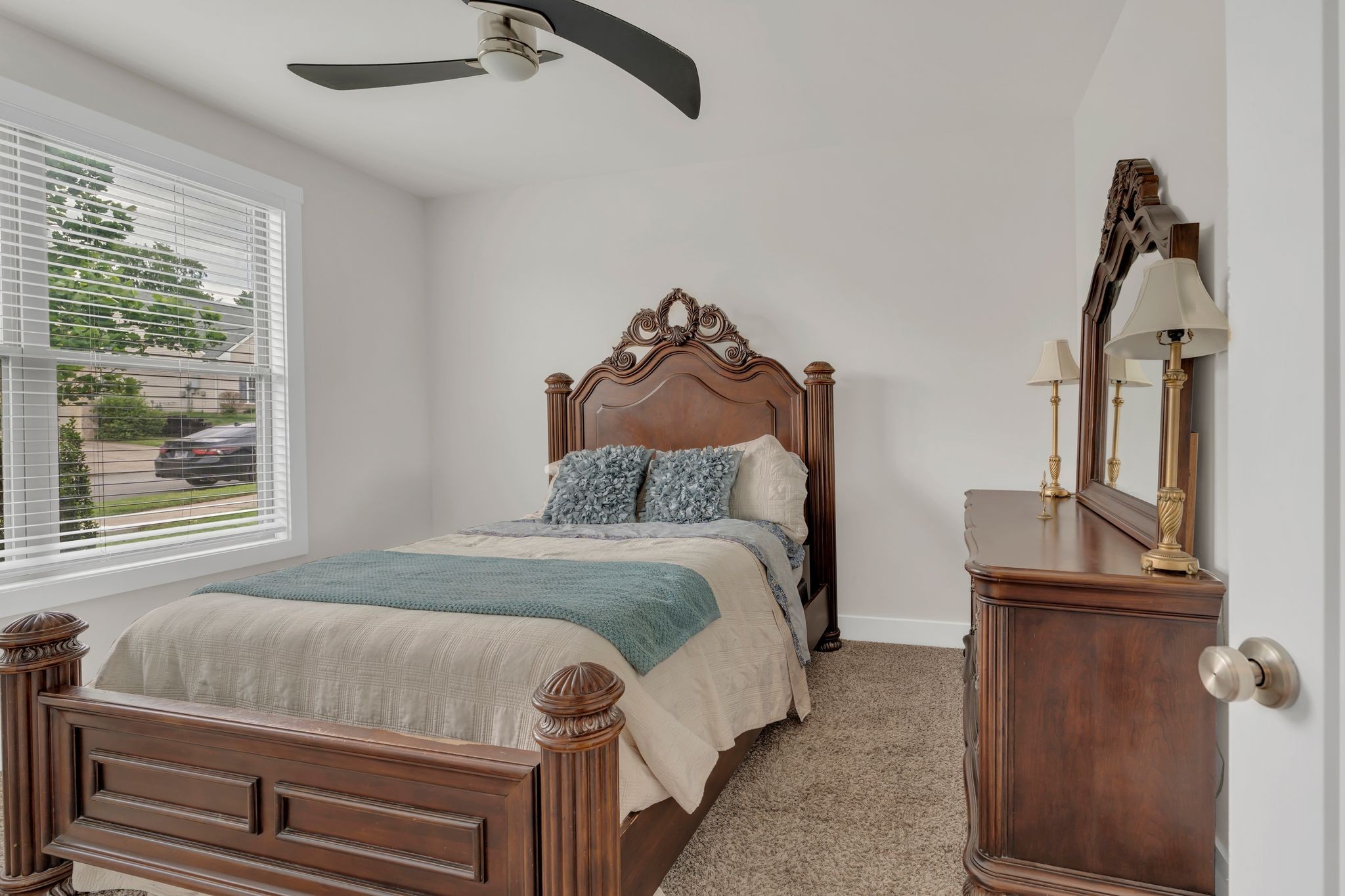 1708 Comanche Run Madison, TN 37115 - Photo 6 of 36 a bed sitting in a bedroom next to a window