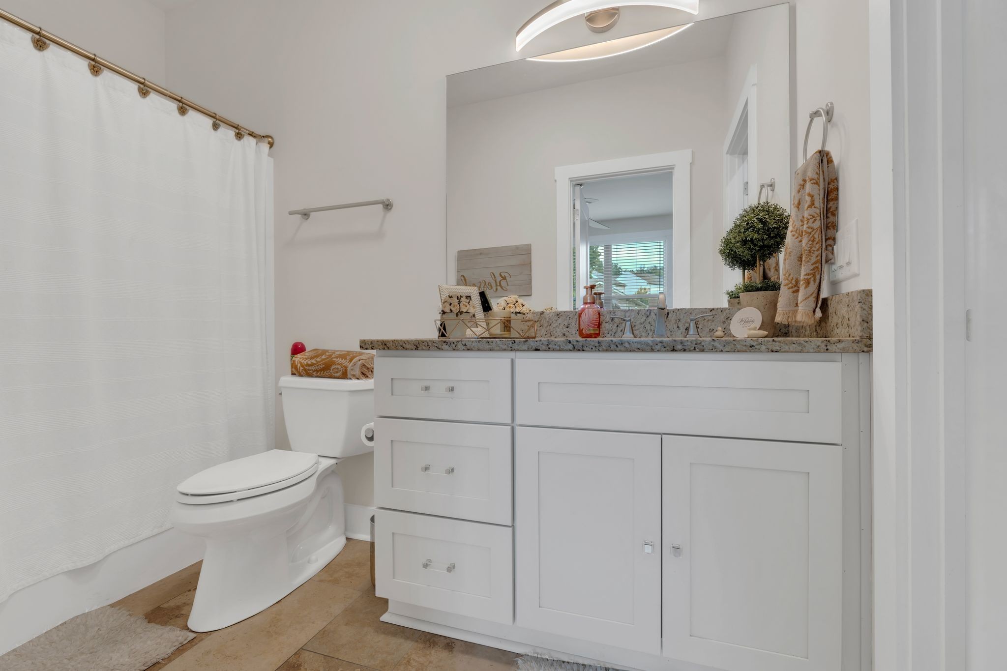 1708 Comanche Run Madison, TN 37115 - Photo 8 of 36 a bathroom with a granite countertop toilet sink and mirror