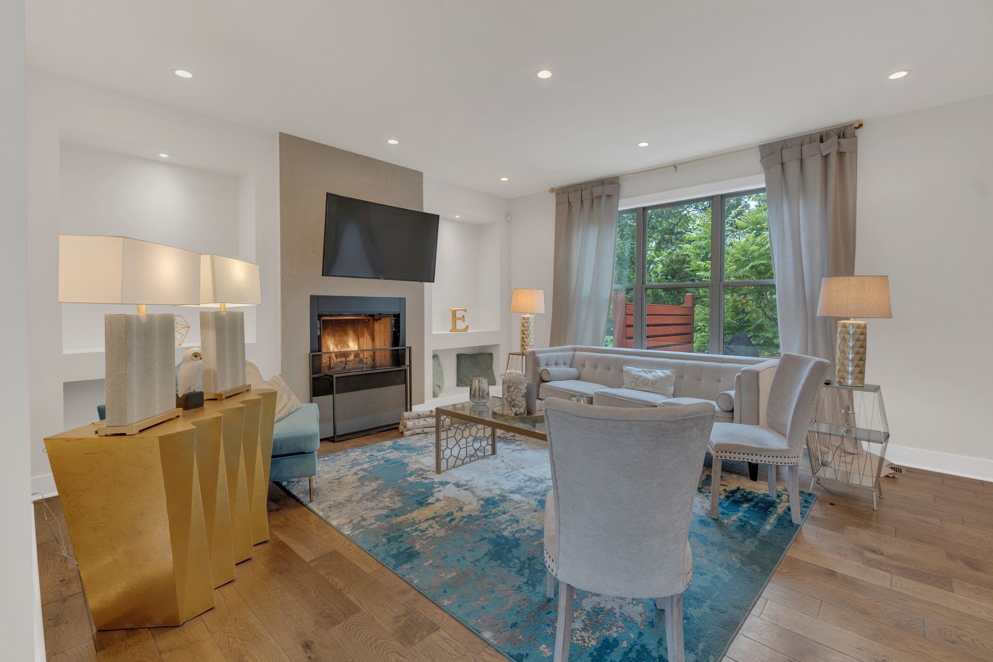 1708 Comanche Run Madison, TN 37115 - Photo 10 of 36 a living room with furniture a flat screen tv and a fireplace