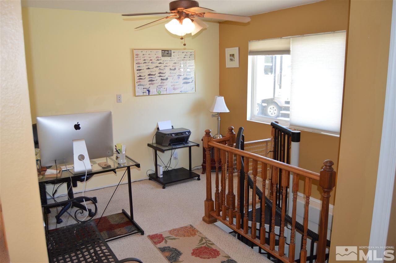 5860 Quaking Aspen Road Reno, NV 89510 - Photo 13 of 25 a bedroom with furniture and a window
