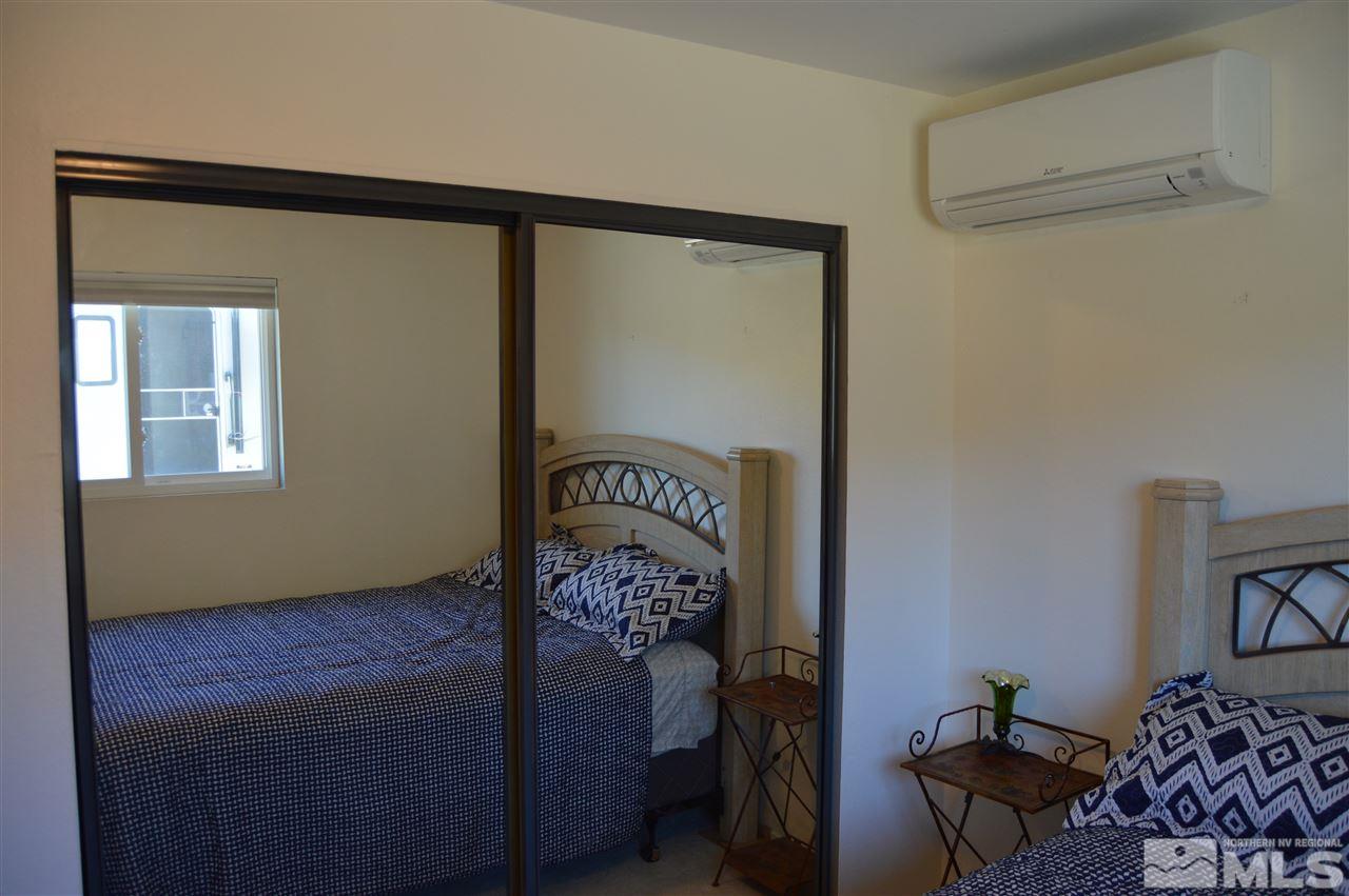 5860 Quaking Aspen Road Reno, NV 89510 - Photo 15 of 25 a bedroom with a bed and a window