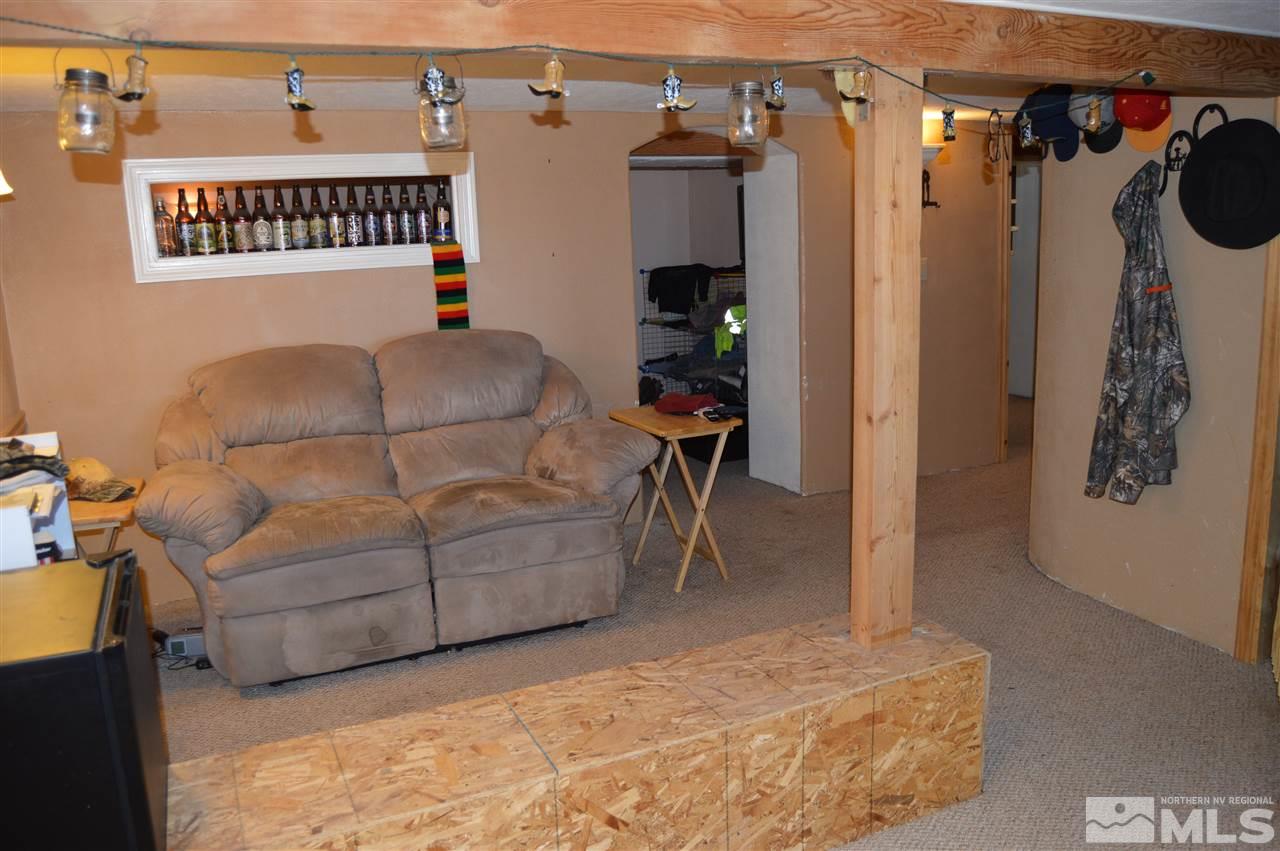 5860 Quaking Aspen Road Reno, NV 89510 - Photo 22 of 25 a bedroom with furniture and a bed