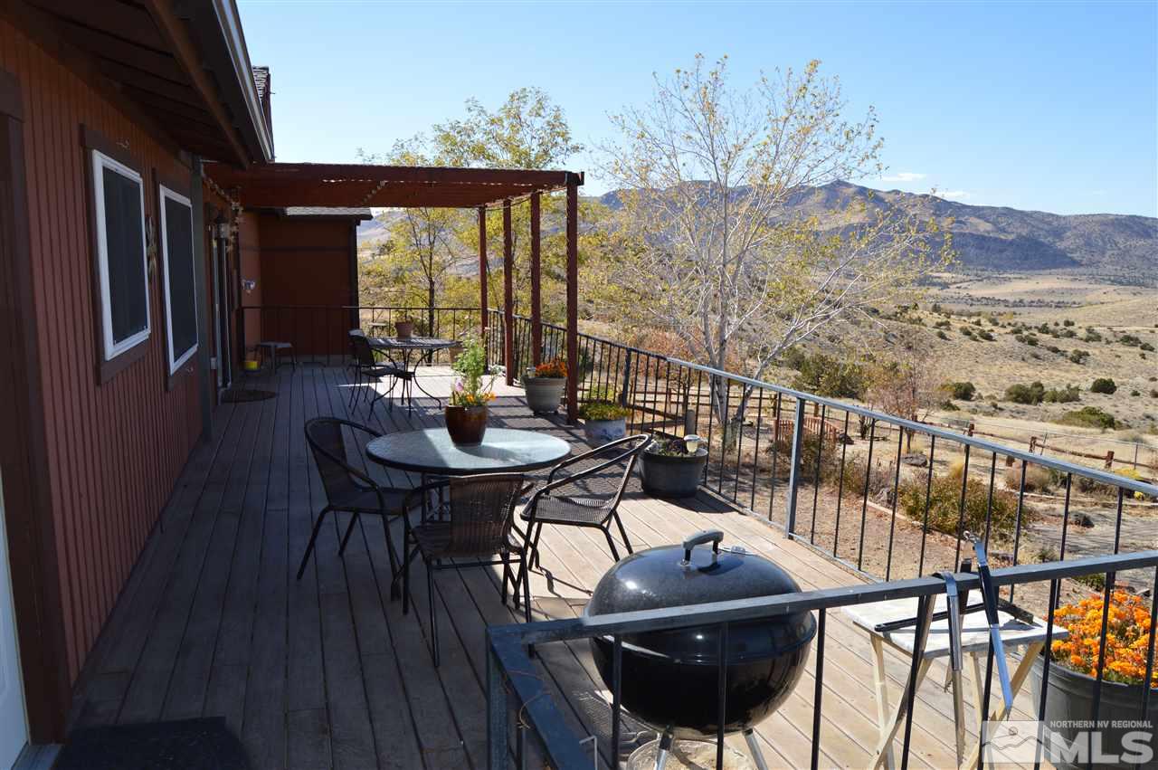 5860 Quaking Aspen Road Reno, NV 89510 - Photo 3 of 25 a view of a balcony dining area with furniture window