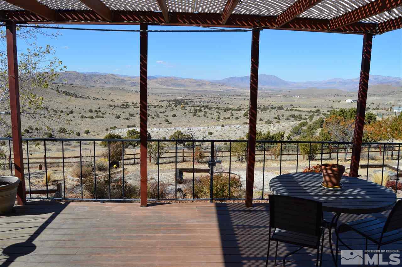 5860 Quaking Aspen Road Reno, NV 89510 - Photo 4 of 25 a view of a balcony with furniture and next to a window