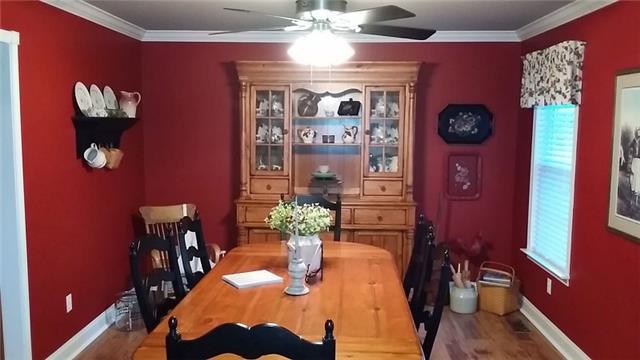 5846 Shady Grove Road Morrison, TN 37357 - Photo 6 of 20 a view of a dining room with furniture a chandelier and wooden floor