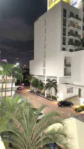 a swimming pool with outdoor seating and yard